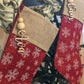 Two stockings hanging both with name stocking tags hanging in front